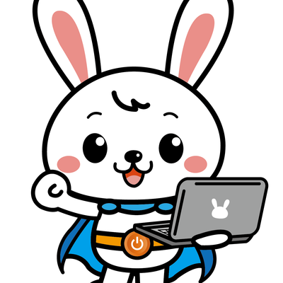 パソコン片手にガッツポーズ。オリジナルキャラクターのラビー。