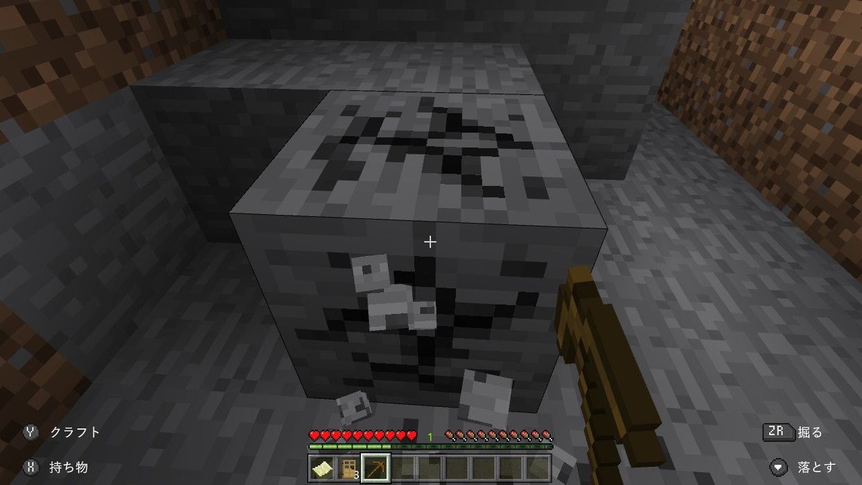 マインクラフトのゲーム画面。「丸石」ブロックが表示されている