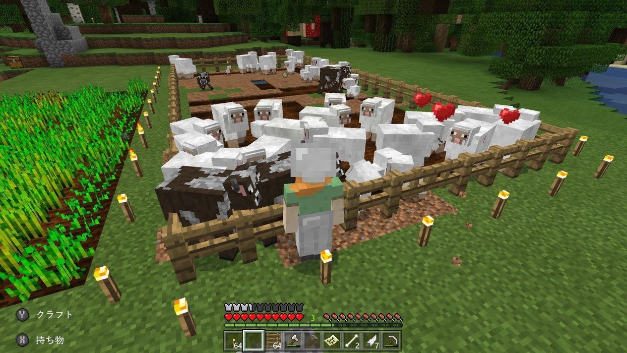 羊の群れの隣に立っている人がいるマインクラフトゲーム